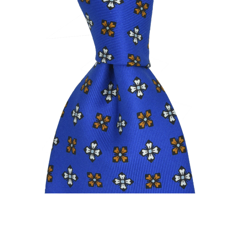 Amidé Hadelin | Wide handprinted silk medallion tie untipped, blue_knot