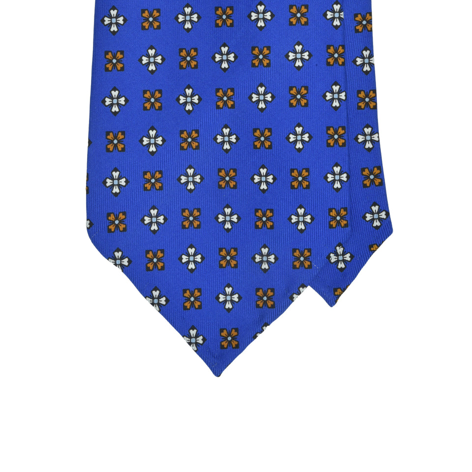 Amidé Hadelin | Wide handprinted silk medallion tie untipped, blue_tip