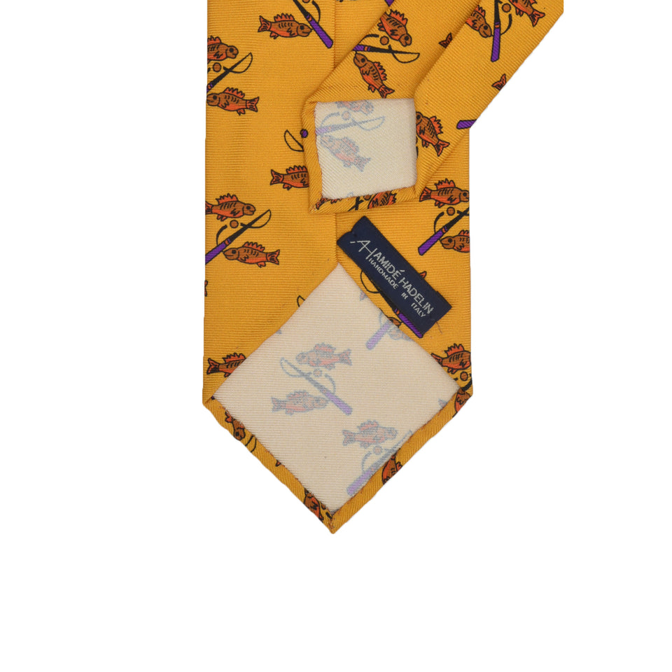 Amidé Hadelin | Handprinted silk fishes tie untipped, yellow_back