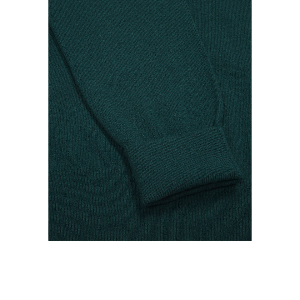 Amidé Hadelin | Super Geelong V-neck jumper - dark green_cuff